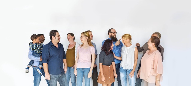 a group of people talking and laughing