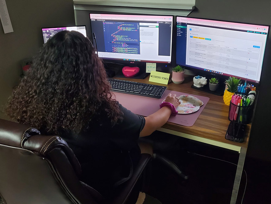 Customer Support staff wearing cat masks to celebrate a birthday.