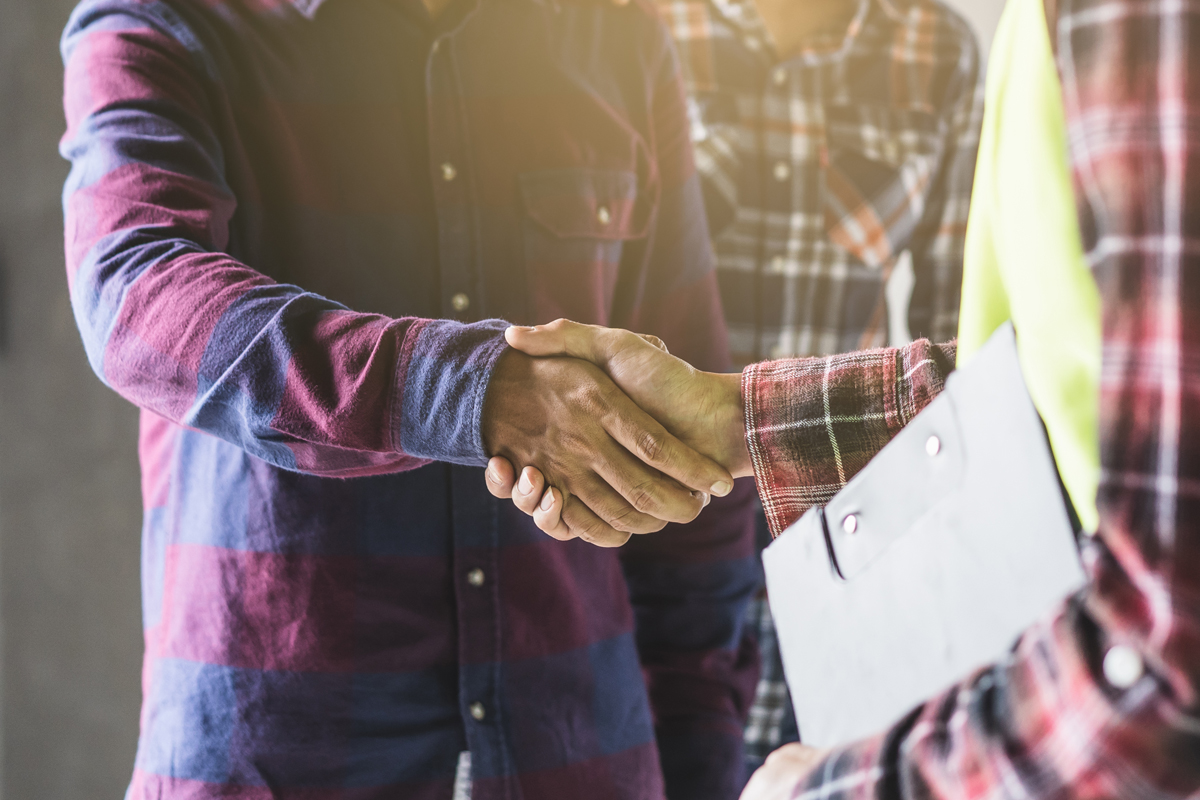 Photo of two people shaking hands when they come to an agreement